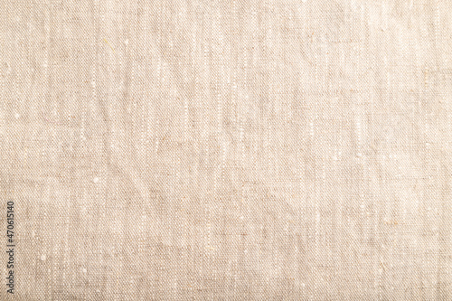 Fragment of smooth white linen tissue. Top view, natural textile background.