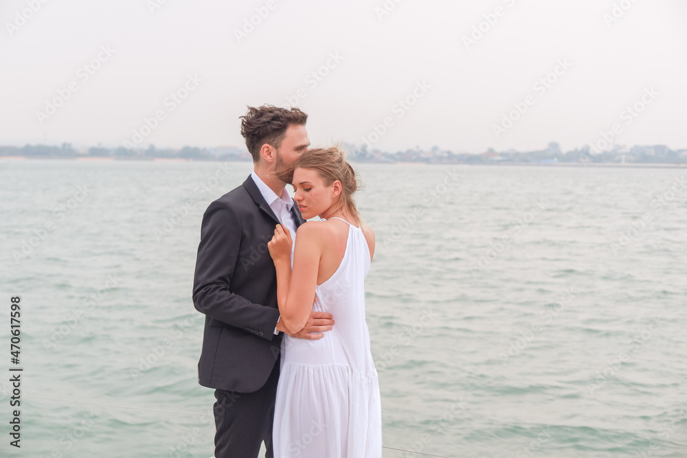 Portrait caucasian couple in love romance on luxury yacht in ocean
