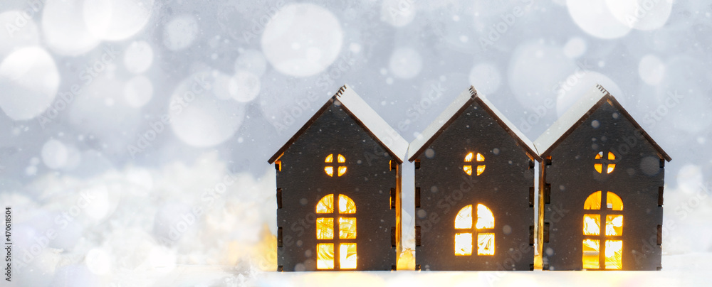 Christmas background with copy space. Decorative gray house on a white snowy background, banner.