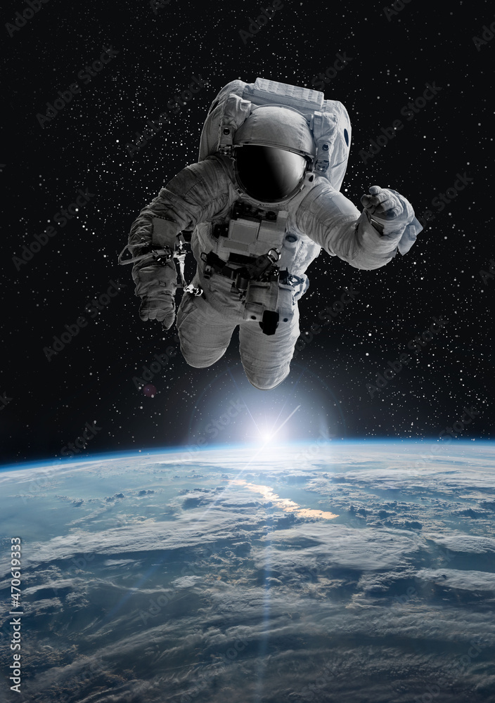 Astronaut in outer open space over the planet Earth.Stars provide the background.erforming a space above planet Earth.Sunrise,sunset.Our home. ISS.Elements of this Image Furnished by NASA. Astronaut in outer open space over the planet Earth.Stars provide the background.erforming a space above planet Earth.Sunrise,sunset.Our home. ISS.Elements of this Image Furnished by NASA.