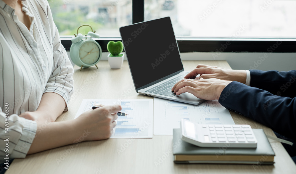 Two business leaders talk about charts, financial graphs showing results are analyzing and calculating planning strategies, business success building processes Two business leaders talk about charts, financial graphs showing results are analyzing and calculating planning strategies, business success building processes