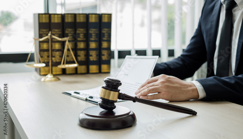 Professional man lawyers work at a law office There are scales, Scales of justice, judges gavel, and litigation documents. Concepts of law and justice