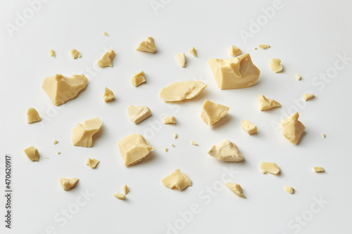 Scattered pieces of solid Theobroma oil
