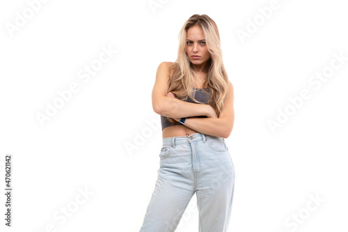 serious blonde on a white background with folded hands on her chest © Ivan Traimak