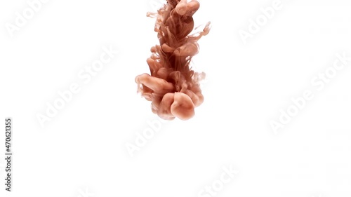 Brown coffee color paint flows down in transparent water as decorative abstract background slow motion extreme close view