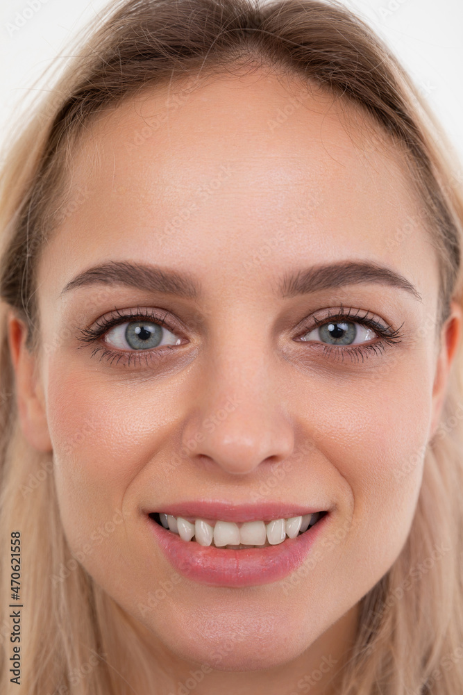close-up portrait of a beautiful blonde with straight white teeth close-up portrait of a beautiful blonde with straight white teeth