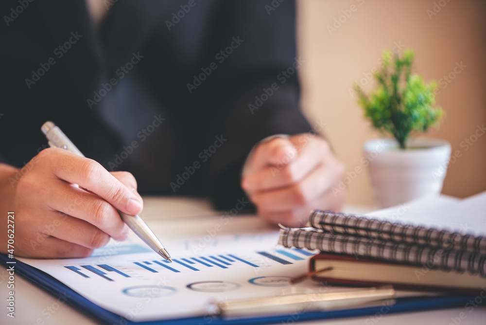 business woman work in the business office on the desk business woman work in the business office on the desk