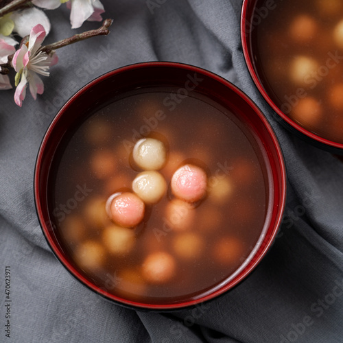 Red and white tangyuan with syrup soup.