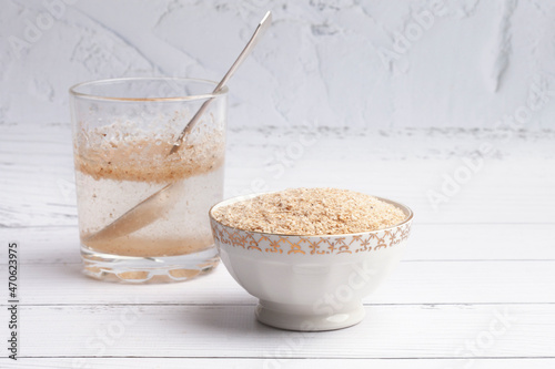 Psyllium husk in a white plate, a superfood prebiotic fiber for gut health
