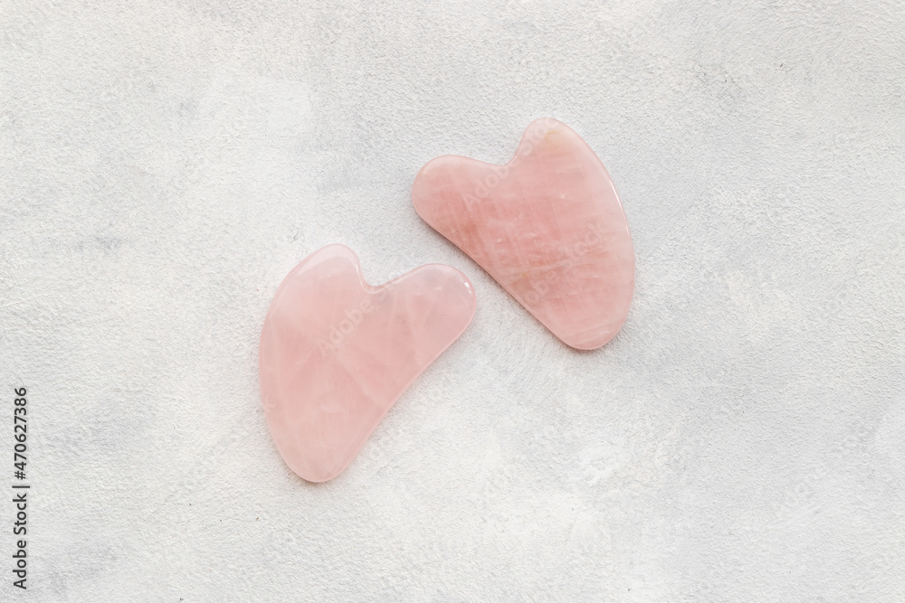 Fototapeta premium Pink chinese gua sha massage stone for lifting face and wellness