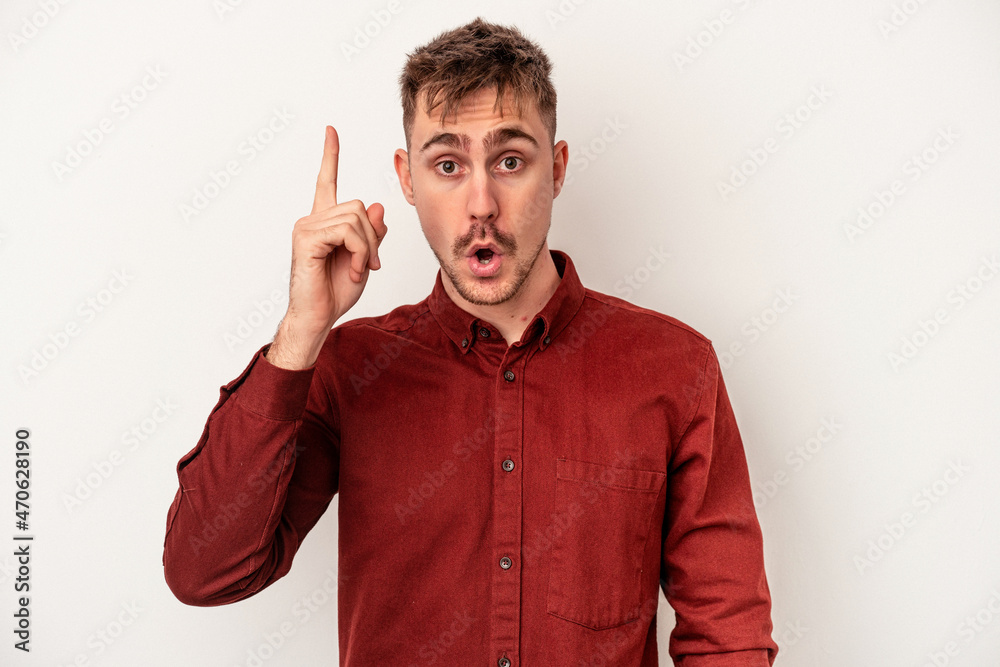 Young caucasian man isolated on white background being shocked because of something she has seen. Young caucasian man isolated on white background being shocked because of something she has seen.