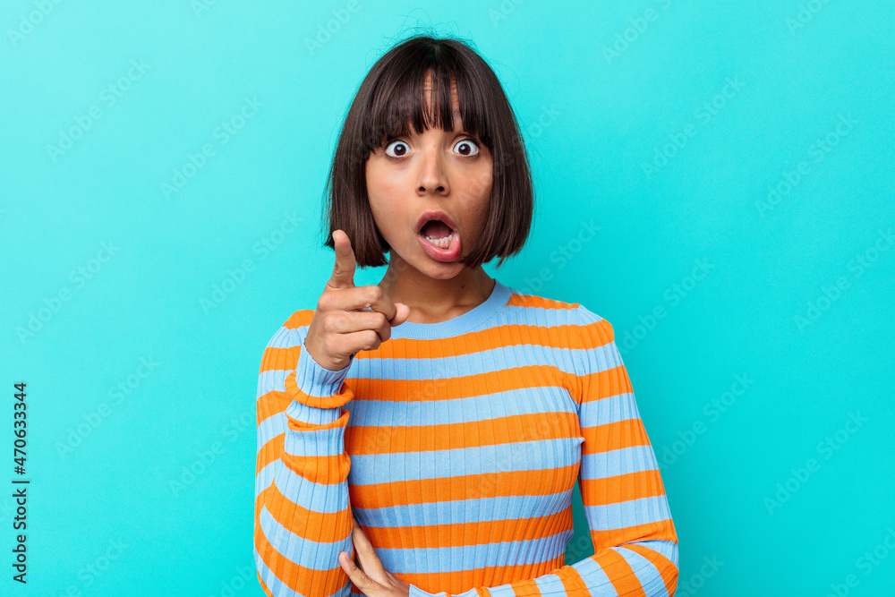 Young mixed race woman isolated on blue background having an idea, inspiration concept. Young mixed race woman isolated on blue background having an idea, inspiration concept.