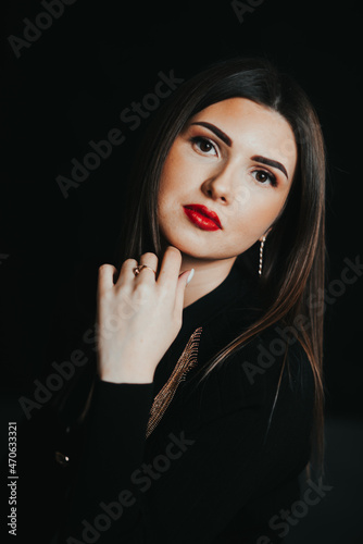 portrait of a beautiful and natural girl with makeup on a black background