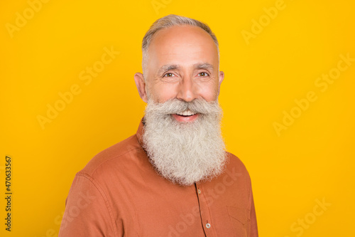 Profile side photo of cheerful aged man good mood glad boss leader isolated over yellow color background