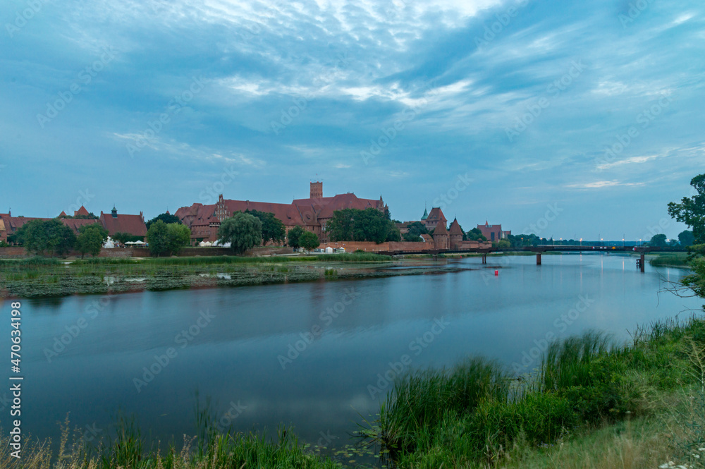 Evening view on Teutonic Castle on Nogat river in Malbork.