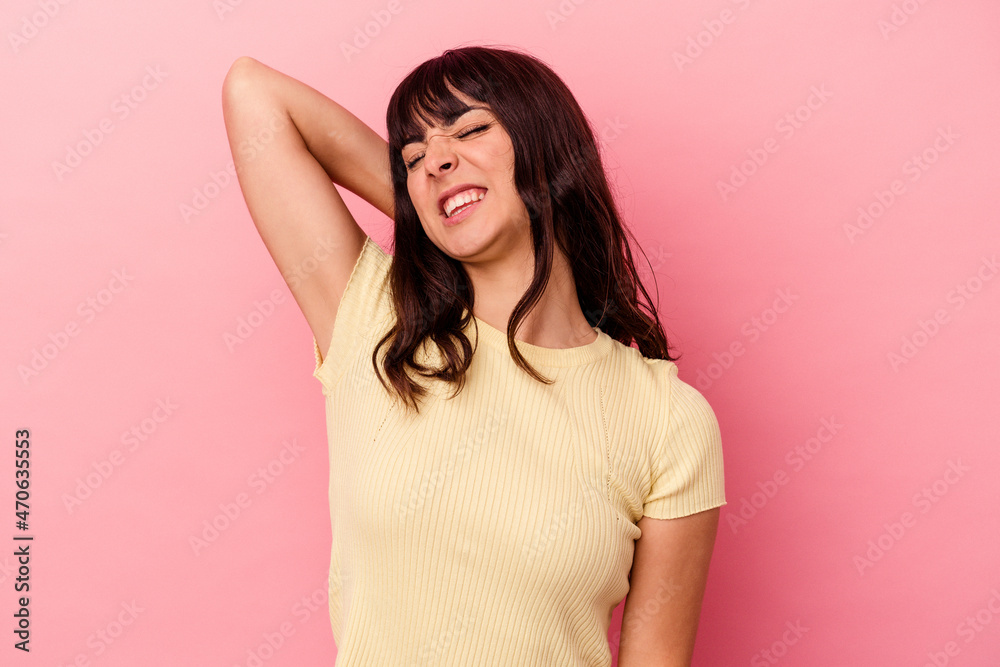 Obraz premium Young caucasian woman isolated on pink background suffering neck pain due to sedentary lifestyle.