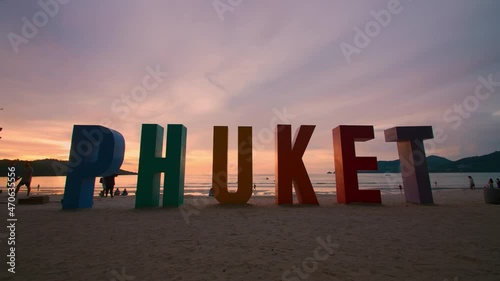 Phuket sign multi color on beach at Patong beach , Phuket Thailand. The beach with PHUKET sign and tourists on the beach
