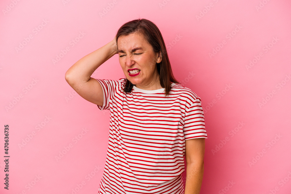 Middle age caucasian woman isolated on pink background celebrating a victory, passion and enthusiasm, happy expression. Middle age caucasian woman isolated on pink background celebrating a victory, passion and enthusiasm, happy expression.