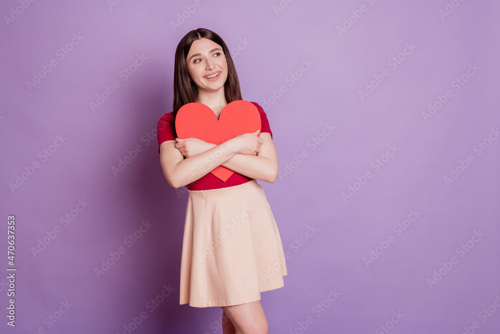 Portrait of affectionate dreamy inspired lady hug big red heart card look empty space on purple background Portrait of affectionate dreamy inspired lady hug big red heart card look empty space on purple background