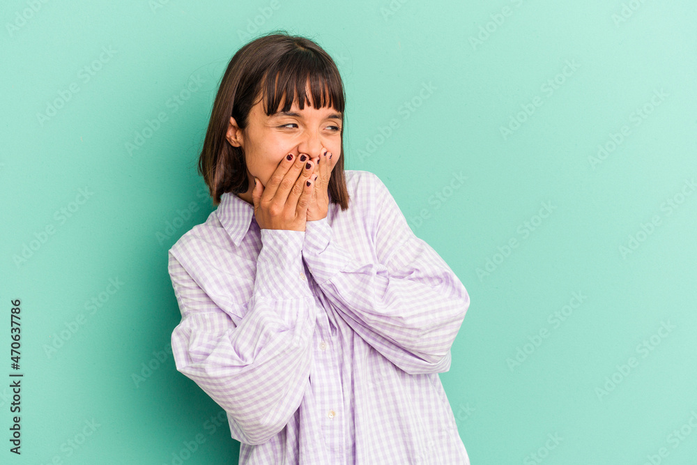 Young mixed race woman isolated on blue Young mixed race woman isolated on blue background smiling cheerful showing number five with fingers. Young mixed race woman isolated on blue Young mixed race woman isolated on blue background smiling cheerful showing number five with fingers.