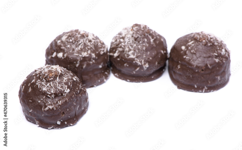 Group of chocolate glazed cakes with coconut chips Group of chocolate glazed cakes with coconut chips