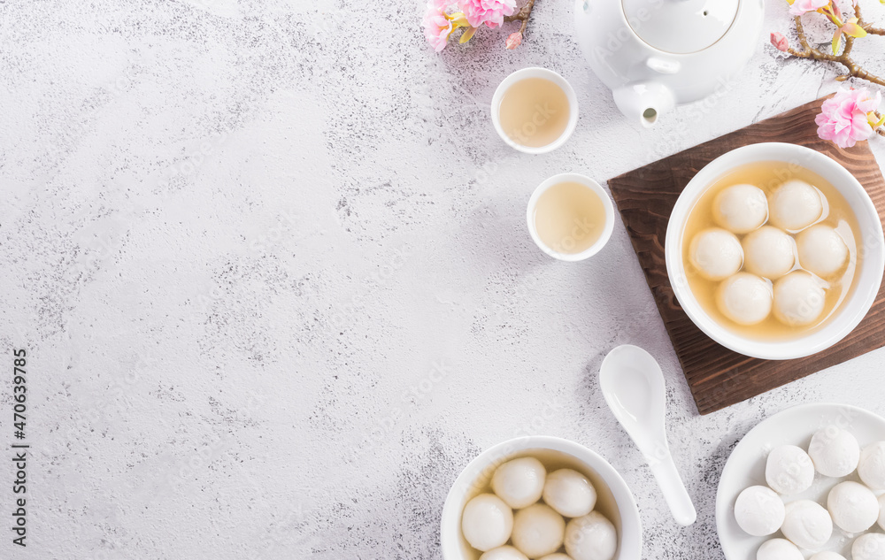 Top view of Tang Yuan(sweet dumplings balls) on stone background. Traditional cuisine for lantern festival, Mid-autumn, Dongzhi (winter solstice festival) and Chinese new year.