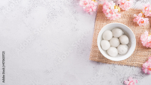 Top view of Tang Yuan sweet dumplings balls  on stone background. Traditional cuisine for lantern festival  Mid-autumn  Dongzhi  winter solstice festival  and Chinese new year.