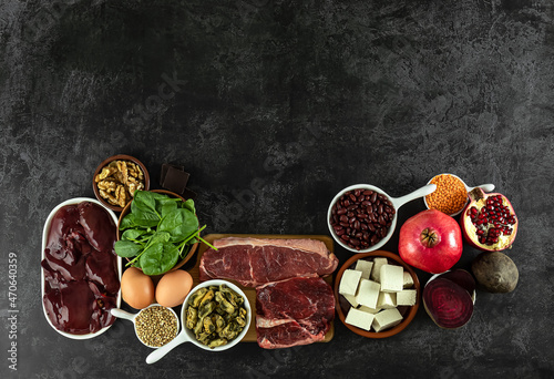 Foods high in Iron, including eggs, nuts, spinach, beans, tofu, liver, beef, beetroot, mussels, and dark chocolate.