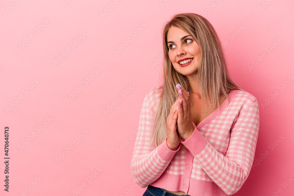 Young russian woman isolated on pink background making up plan in mind, setting up an idea. Young russian woman isolated on pink background making up plan in mind, setting up an idea.