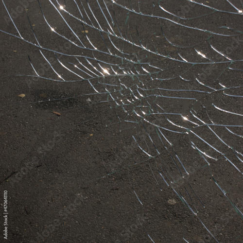 Broken glass over natural background.