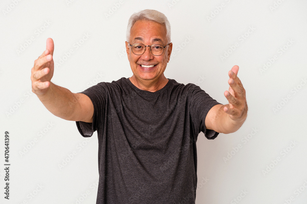 Senior american man isolated on white background celebrating a victory or success, he is surprised and shocked. Senior american man isolated on white background celebrating a victory or success, he is surprised and shocked.