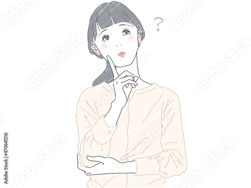 人差し指を立てて首を傾げる女性