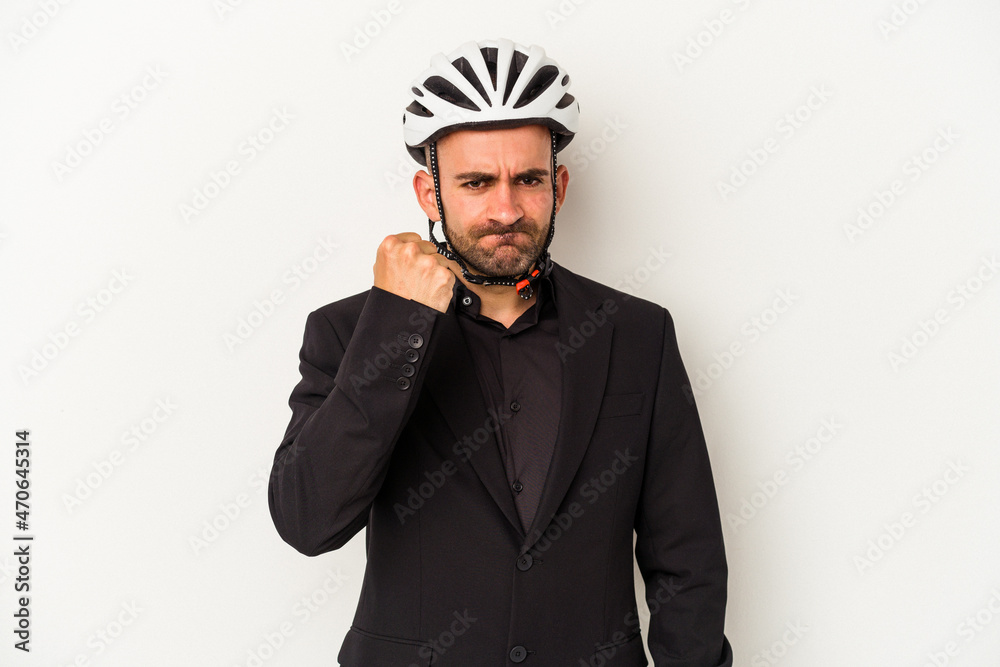 Young business bald man wearing a bike helmet isolated on white background  showing fist to camera, aggressive facial expression.