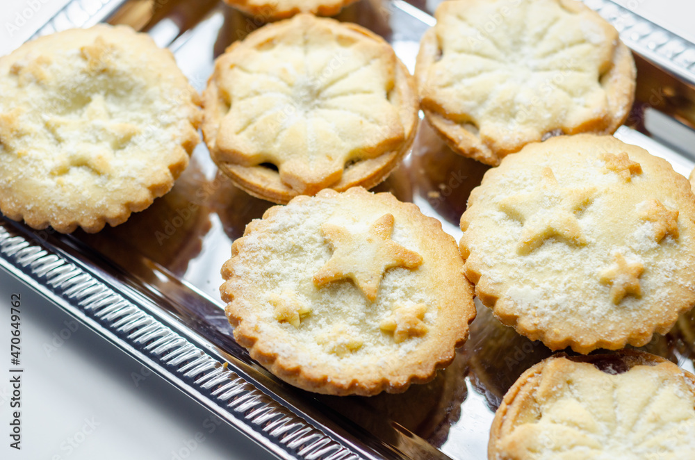 All-butter pastry pies with a mincemeat filling with spiced vine fruits, Christmas cookies