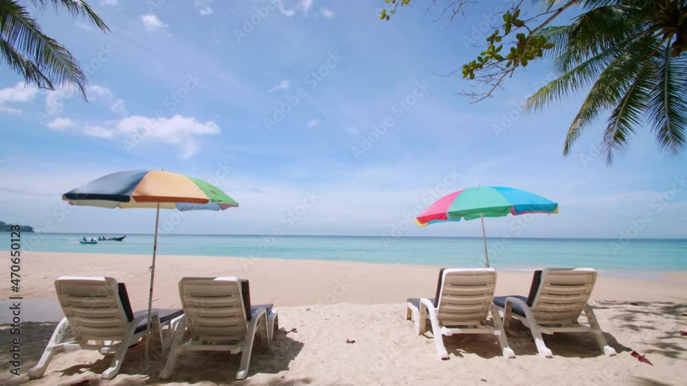 Phuket Thailand Holiday travel vacation. Tropical beach with sand and coconut palms tree. Beautiful tropical beach with beach chair and beach umbrella Phuket Thailand Holiday travel vacation. Tropical beach with sand and coconut palms tree. Beautiful tropical beach with beach chair and beach umbrella