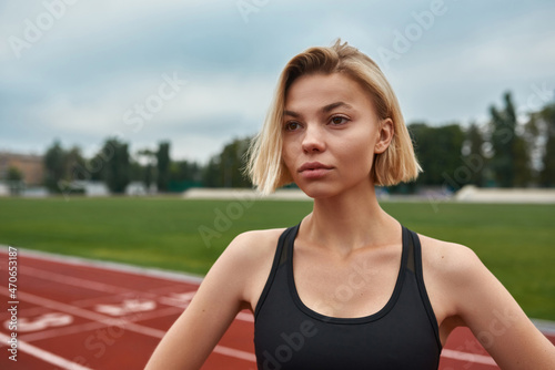 Young european sports woman on stadium treadmill © Svitlana