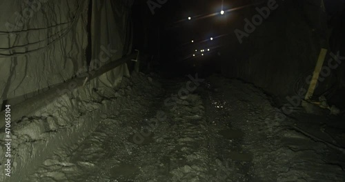 A walking through the mine in the dark photo