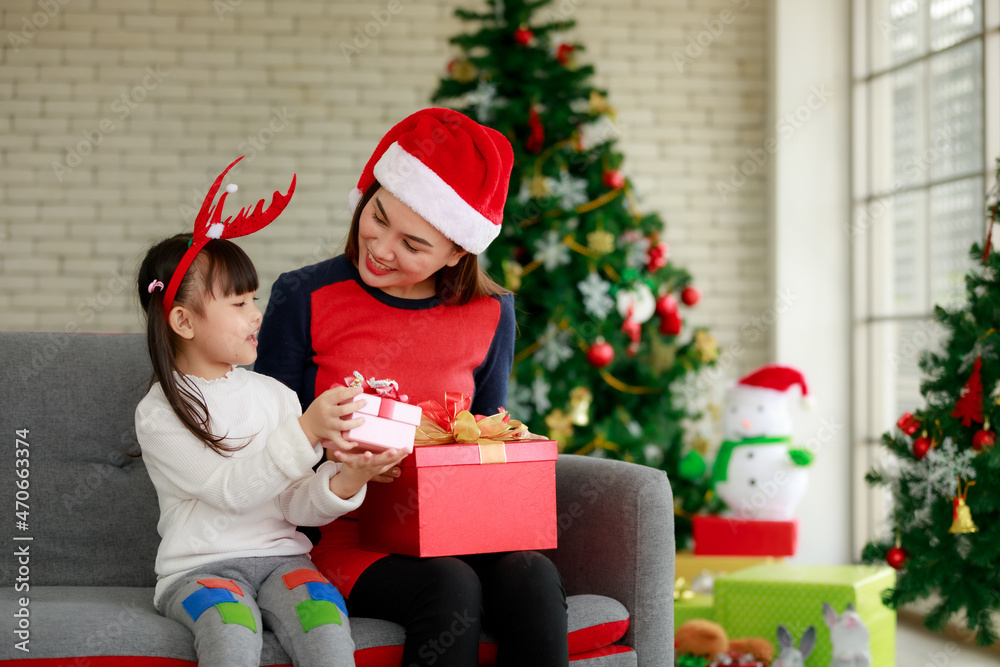 Happy family mother and children with Christmas gifts at home . Happy family mother and children with Christmas gifts at home .