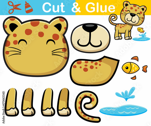 Fototapeta Naklejka Na Ścianę i Meble -  Vector illustration of leopard cartoon with little fish. Education paper game for children. Cutout and gluing.