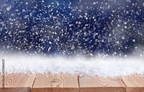 christmas background with wooden table top and snow