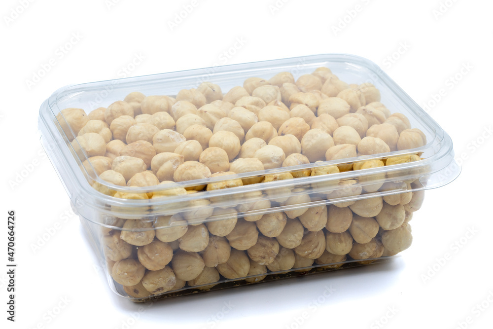 Packed peeled hazelnuts isolated on a white background. Snack fresh hazelnuts. close up Packed peeled hazelnuts isolated on a white background. Snack fresh hazelnuts. close up