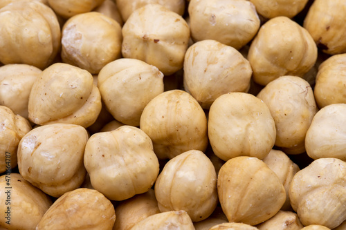 Close-up of peeled hazelnuts. food background. Snack Fresh Nuts.