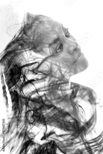 A portrait of a woman combined with an image of smoke in a double exposure technique.