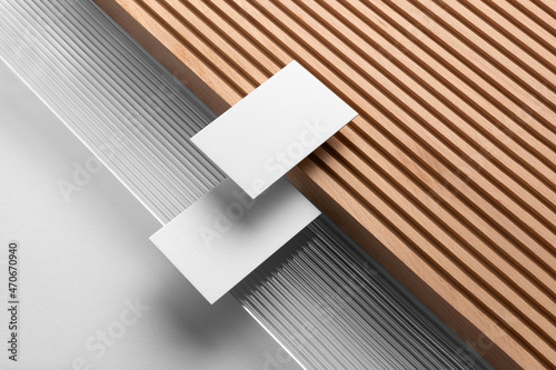 Business Cards Branding stationery mockup template, with reeded glass and wooden elements, real photo. Blank isolated on a white background to place your design. 