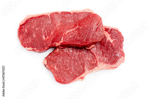 Fresh raw steaks on white background.