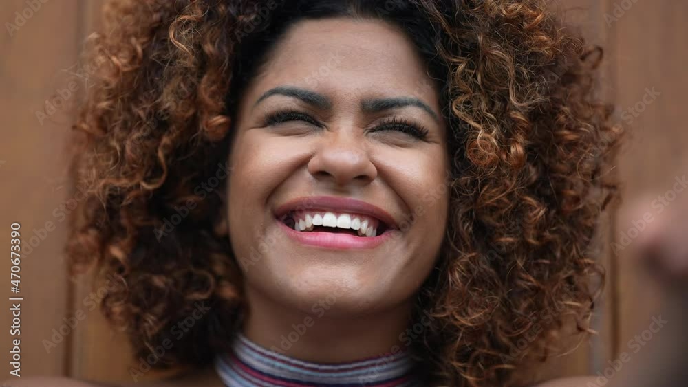 Black African woman laughing and smiling close-up face authentic real life smile Black African woman laughing and smiling close-up face authentic real life smile