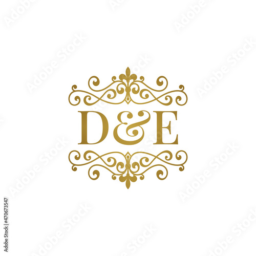 D&E initials logo ornament gold. Letter DE wedding ampersand or business partner symbol.	