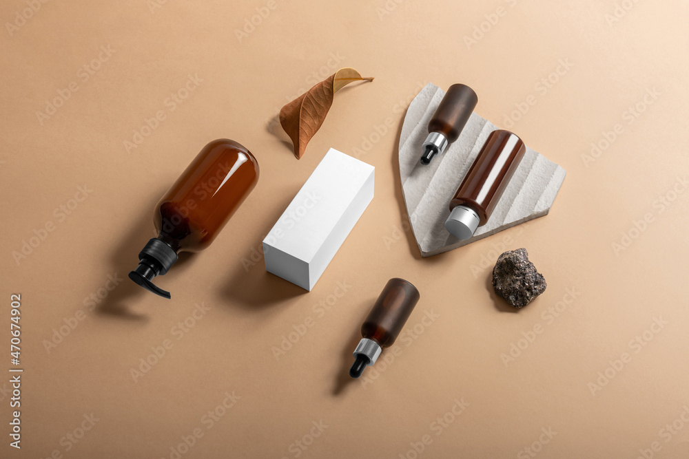 Cosmetics packaging branding mockup template with the casual organic vibe, dropper, dispenser brown bottles, packaging, and branding items. Blank isolated on the beige background to place your design Cosmetics packaging branding mockup template with the casual organic vibe, dropper, dispenser brown bottles, packaging, and branding items. Blank isolated on the beige background to place your design