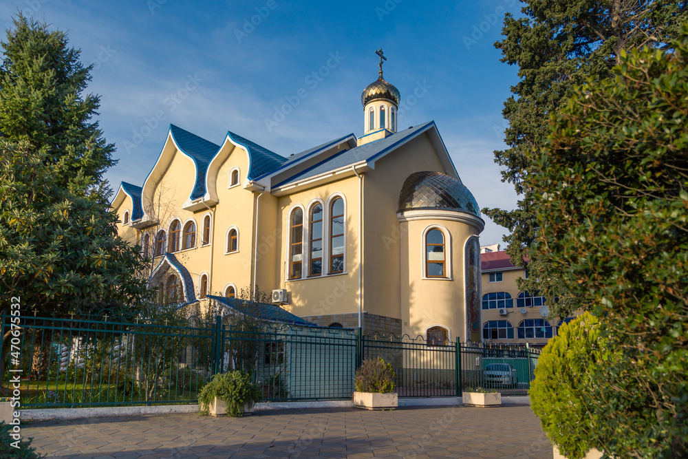 view of a beautiful church with a blue roof, an Orthodox church