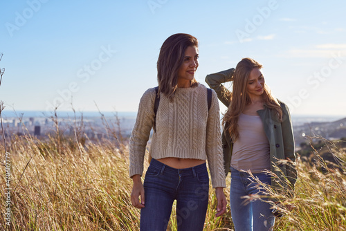 Two happy ladies in a field photo